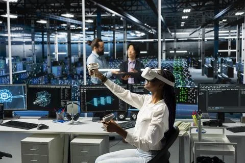 Admin in data center using AI virtual reality to troubleshoot rigs issues Stock Photos