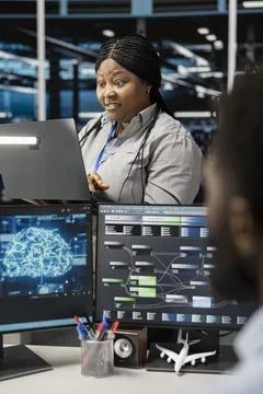 Admin in data center using artificial intelligence floored by impressive results Stock Photos