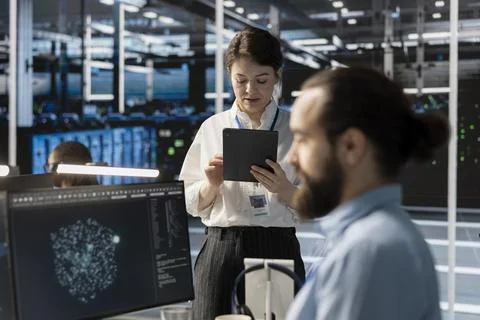 Admin in data center using tablet to update storage arrays software 스톡 사진
