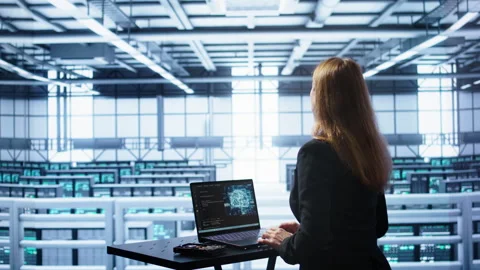 Admin in data center works with artificial intelligence computerized model Stock Footage 277659005