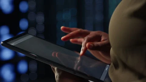 Admin in high tech data center using tablet to deploy new server architecture Stock Footage 317126799