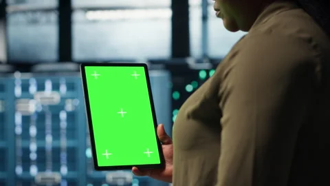 Admin with isolated screen tablet in data center doing power management Stock Footage 317124795