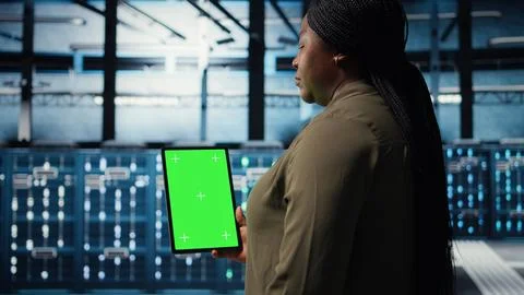 Admin with isolated screen tablet in data center doing power management Stock Photos