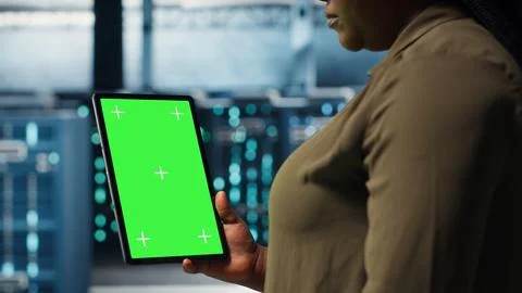 Admin with isolated screen tablet in data center doing power management Stock Photos
