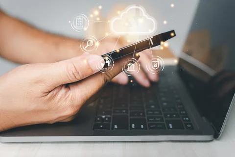 Admin man uses a smartphone and laptop with a cloud computing diagram displ.. Stock Photos
