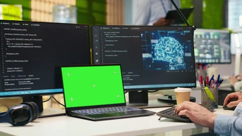 Admin in office uses isolated screen laptop, automating repetitive tasks with AI Stock Footage 313165747
