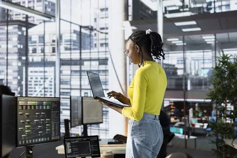 Admin in office using laptop to develop machine learning algorithms Stock Photos
