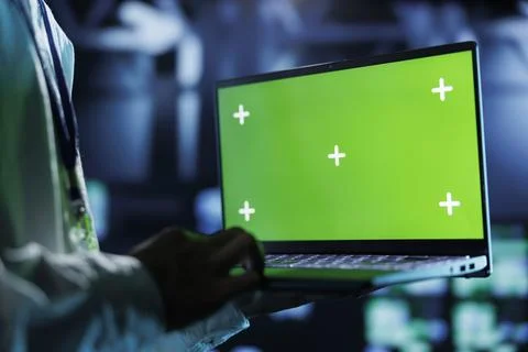 Admin runs code on chrome key laptop Stock Photos