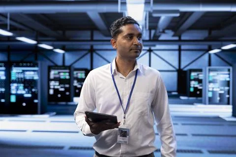 Admin in server hub checking recovery plan on tablet, monitoring data center Stock Photos