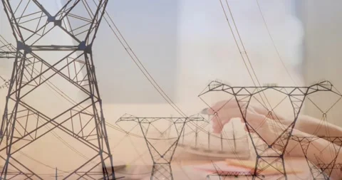 Admin starting typing on keyboard while power towers overlay, composing energy Stock Footage 330676318