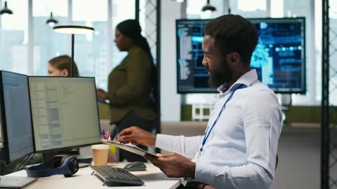 Admin in tech startup office using PC, compiling software patches to fix bugs 스톡 동영상 313164653