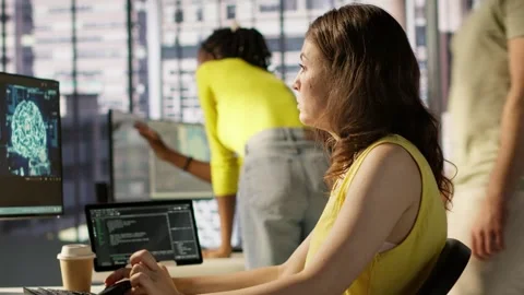 Admin tests on computer and tablet to optimize artificial intelligence tech Stock Footage 318160436