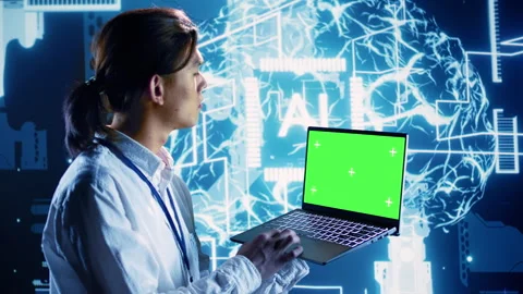 Admin uses green screen laptop for AI Stock Footage 249019565