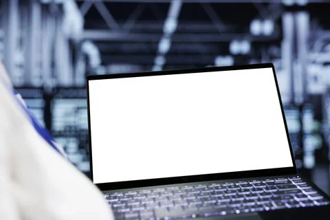 Admin uses mock up laptop in data center Stock Photos