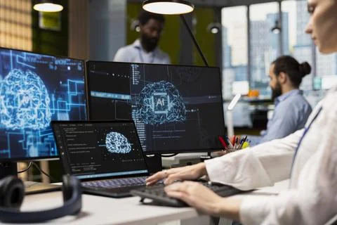 Admin using devices to adjust neural networks algorithms parameters 写真素材