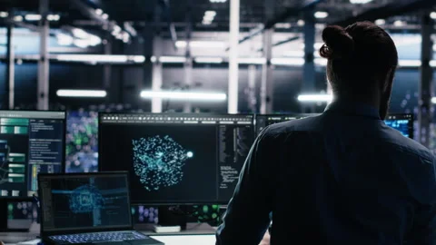 Admin using devices in data center, coding with generative AI Stock Footage 313567120