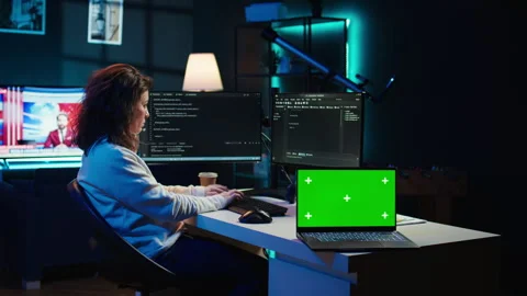 Admin using green screen laptop to implement security measures Stock Footage 283594187