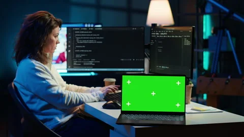 Admin using green screen laptop to implement security measures Stock Footage 283594770