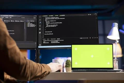 Admin using green screen laptop to filter malicious traffic Foto stock