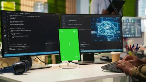 Admin using isolated screen tablet to code AI algorithms debugging software Stock Photos