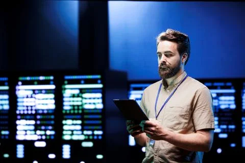 Admin walking in high tech data center Stockfoto's