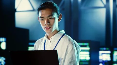 Admin walks through data center systems Stock Photos