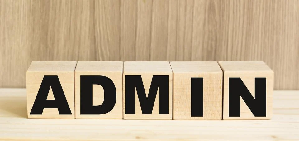 ADMIN word built with letters cubes on wooden table Stock Photos
