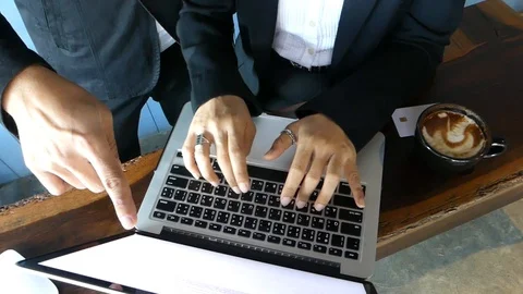 Admin is working on the board, A finger point to the computer screen. Stock-Footage 97339026