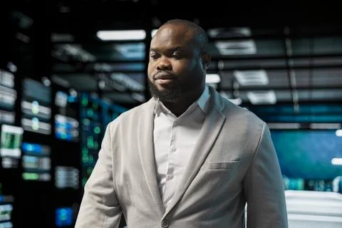 Admin working in data center, overseeing infrastructure mainframes Stock Photos