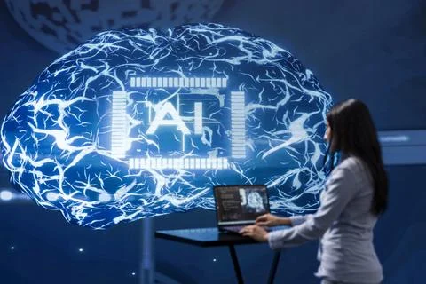 Admin working on laptop in cutting edge workspace featuring AI systems Stock Photos