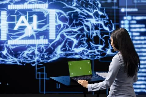 Admin works on mockup notebook to automatize tasks using artificial intelligence Stock Photos