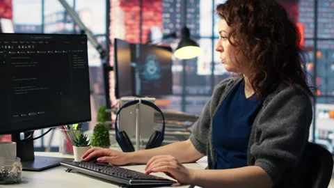 Admin writing code doing maintenance on artificial intelligence neural networks Stock Footage 308597614