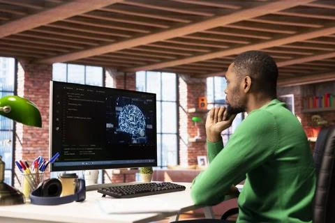 Admin writing code on PC and doing maintenance on artificial intelligence Stock Photos