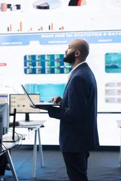 Administrative assistant examining important big data visualizations Stock Photos