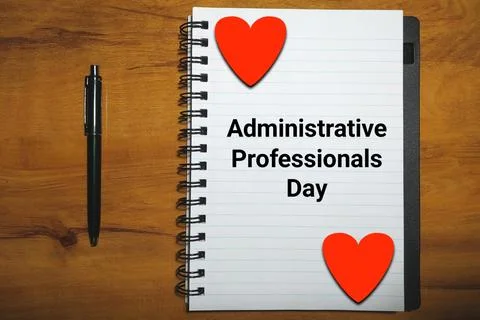 Administrative Professionals Day on notebook with pen and hearts on wood Illustrazione stock