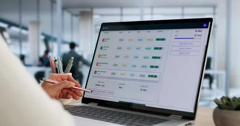 Administrative Work Using Computer Tool To Track Daily Timesheet Stock Photos