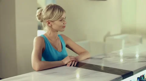 Administrator of spa complex communicates with the client at the reception Stock Footage 60142485