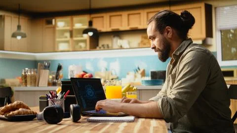 Administrator working remotely with AI tools and laptop for data and metrics Stock Photos