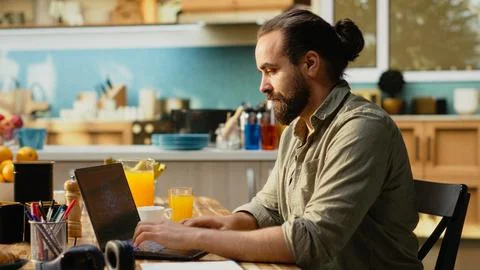 Administrator working remotely with AI tools and laptop for data and metrics Stock Photos