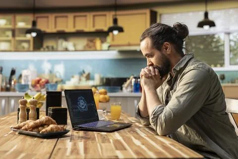 Administrator working remotely with AI tools and laptop for data and metrics Stock Photos