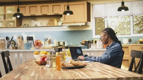 Administrator working remotely with AI tools and laptop for data and metrics Stock Photos