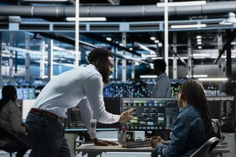 Admins working in data center used for machine learning training Stock Photos