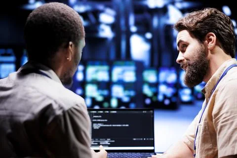 Admins writing blade servers code 写真素材