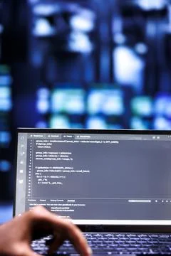 Admins writing code in data center Stockfoto's