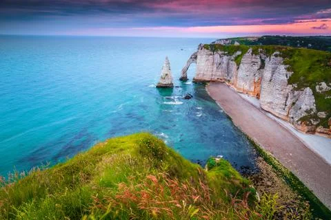 Admirable beach with high cliffs at sunset, Etretat, Normandy, France Stock Photos