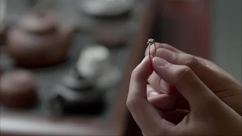 Admire the diamond ring in your hand Stock Footage 261510971