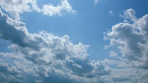 Admiring the Beautiful Cloud Patterns that Grace the Expansive Bright Blue Sky A Stock Photos