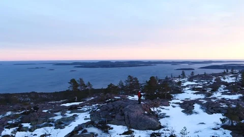 Admiring the view from the top of a rock Видео 105849955