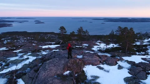 Admiring the view from the top of a rock Stock Footage 105850028