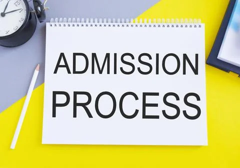 Admission Process text written on a notebook with pencil, yellow and gray bac Stock Photos
